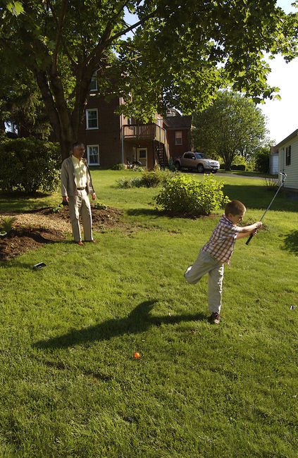 Hitting golfballs in the backyard
James and Dad
Keywords: James Dad