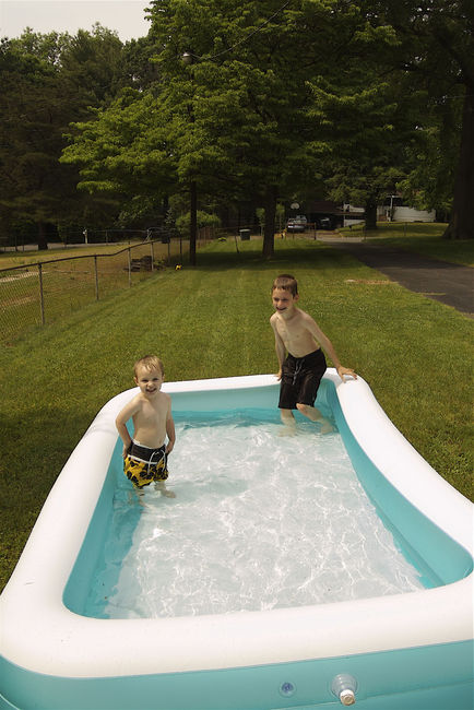 James and David
the neighbors' toddler loves the pool , james too!
